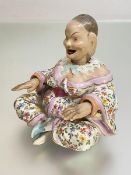 A Naples porcelain "pagoda" nodding head figure, late 19th century, with moving tongue and hands, in