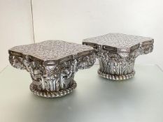 A pair of Indian large white metal capitols of Corinthian type, each gadroon and floral moulded