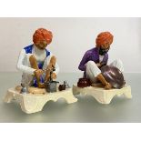 A rare pair of Royal Worcester porcelain figures modelled by James Hadley from the Indian
