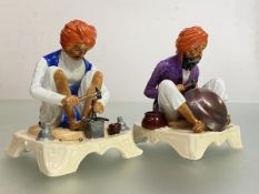 A rare pair of Royal Worcester porcelain figures modelled by James Hadley from the Indian