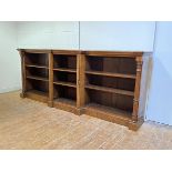 A mid-19th century figured walnut low breakfront bookcase of country house proportions, the