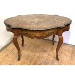 A French walnut centre table of serpentine outline, late 19th century, the quarter-sawn veneered top