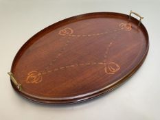 An Edwardian mahogany oval twin-handled tray, inlaid with tulipwood and boxwood with harebell and