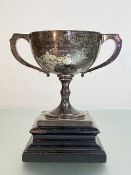 A George V silver twin-handled trophy, A. & J. Zimmerman, Birmingham 1934, the broad bowl on a
