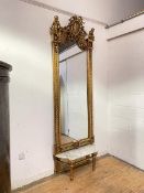 An imposing German pier mirror of Neo-Classical design, 19th century, the giltwood and gesso frame