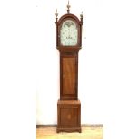 A George III mahogany longcase clock, early 19th century, the arched hood with three associated gilt