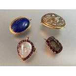 A group of 19th century brooches comprising: a rock crystal heart-shaped locket brooch/pendant,