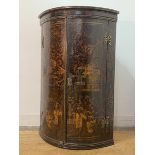 An 18th century Japanned bow fronted hanging corner cupboard, with gilt Chinoiserie and simulated