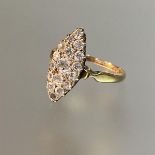 A diamond cluster ring, c. 1900, the navette setting centred by an old-cut stone within a band of