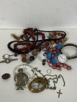 A mixed lot of jewellery including a 9ct gold crucifix (2.5cm) (0.6g), polished stone necklaces,