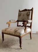 An Edwardian inlaid rosewood open armchair, upholstered in a Neoclassical inspired satinized fabric,