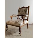 An Edwardian inlaid rosewood open armchair, upholstered in a Neoclassical inspired satinized fabric,