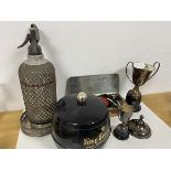 A mixed lot including two Epns trophies, an Epns wine coaster, a 1910-35 Jubilee souvenir tin, a