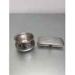 A 1935 Birmingham silver condiment pot (4cm) (34g), a cigarette box marked 900 (9cm) (68g) (2)