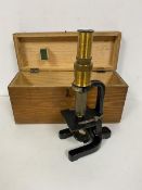 An early 20thc microscope, bears plaque WB Nicolson, Glasgow (26cm) with original travelling case