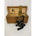 An early 20thc microscope, bears plaque WB Nicolson, Glasgow (26cm) with original travelling case