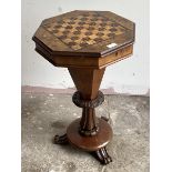 A mid 19th century walnut sewing and games table of trumpet form, the octagonal top with inlaid