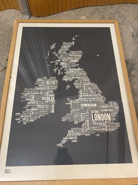 A modern print depicting the UK and Ireland formed of the various cities and towns in text,