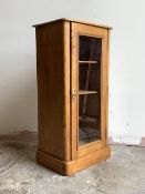 A Victorian pine glazed door cabinet, with two shelves, on a plinth base, H92cm, W45cm, D34cm