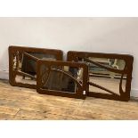 A Pair of wall hanging mirrors of Art Nouveau design with the fret cut painted frames (50cm x