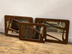 A Pair of wall hanging mirrors of Art Nouveau design with the fret cut painted frames (50cm x