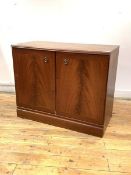 A mahogany two door TV cabinet, the cross banded doors enclosing a shelf, H71cm, W87cm, D45cm