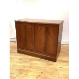 A mahogany two door TV cabinet, the cross banded doors enclosing a shelf, H71cm, W87cm, D45cm