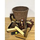 A group of horse brushes with original leather travelling cases, other brushes, wicker basket (a