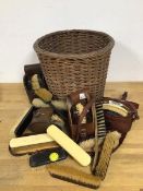 A group of horse brushes with original leather travelling cases, other brushes, wicker basket (a