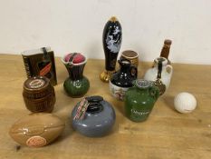 A collection of novelty miniature whisky bottles including a Curling Stone, Beer Tap (16cm), Rugby