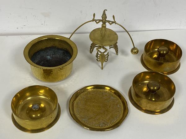 A collection of brassware including three artillery shell trench art bases for use as ashtrays (3.