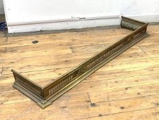 An Edwardian pierced brass fender, L143cm, D34cm