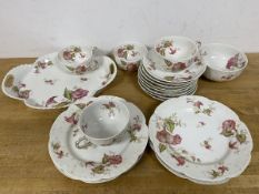 A part Limoges teaset in Ernest Bird pattern stamped Frank Haviland to base includes four teacups