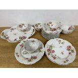 A part Limoges teaset in Ernest Bird pattern stamped Frank Haviland to base includes four teacups