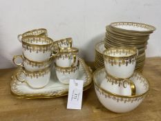 A Paragon china teaset comprising eleven cups, twelve saucers, side plates, milk jug, sugar bowls,