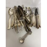 A quantity of cutlery including spoons, knives, forks etc., also a set of six 1950s East Africa