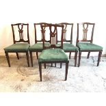 A set of five Edwardian inlaid mahogany dining chairs, with pierced splat back over upholstered