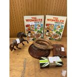 A mixed lot including two Wombles annuals 1976 books, a carved hardwood horse, marble solitaire game