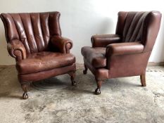 A Pair of George III style barrel back wing armchairs, upholstered in studded ox blood leather,