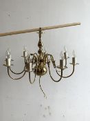 A Brass eight branch Dutch style chandelier, (H46cm) together with a similar three branch