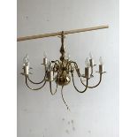 A Brass eight branch Dutch style chandelier, (H46cm) together with a similar three branch