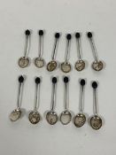 A set of twelve 1920s coffee bean handled spoons (each: 9cm) (combined: 73g)