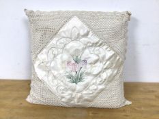 A vintage cushion with tulip embroidery to centre and macrame corners measures 47 x 47