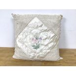 A vintage cushion with tulip embroidery to centre and macrame corners measures 47 x 47