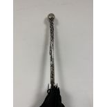 An early 20thc Japanese Samurai Shokai umbrella the white metal handle with inscribed knop McClure