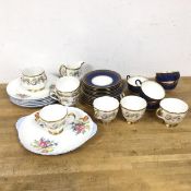 A mixed lot of china including five Wedgwood tea cups with a gilt and mottled lapis lazuli ground,