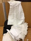 A mixed lot including a collapsible top hat inscribed GIBUS to interior, a christening gown,