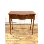 A yew wood hall table of serpentine outline, the cross banded top over two frieze drawers, raised on