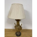 A gilt metal table lamp of rococo inspired form, on marble base and bun feet (a/f) (62cm to top of