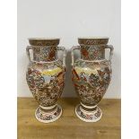 Two 20thc Satsuma vases of baluster form with handles to sides, each with two panels depicting